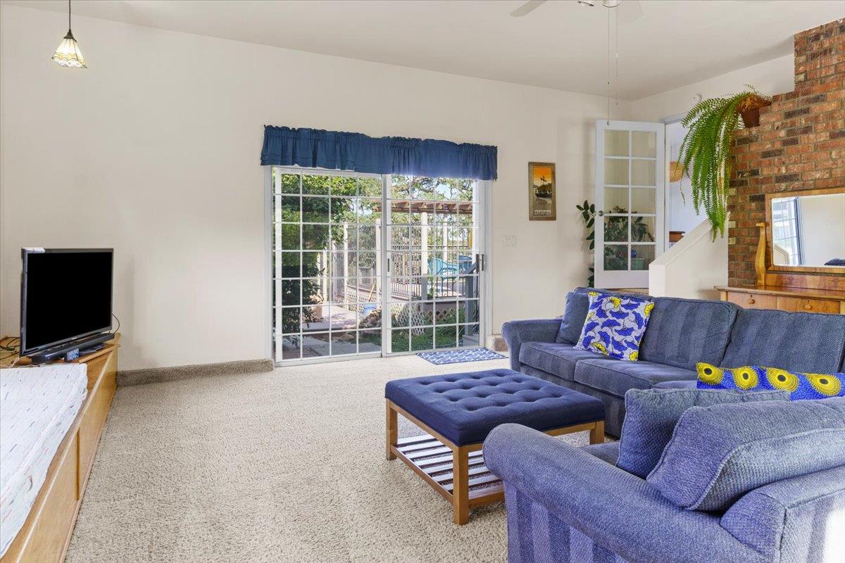 6980 Crystal Boulevard El Dorado, CA 95623 - Photo 36 of 49 a living room with furniture and a flat screen tv