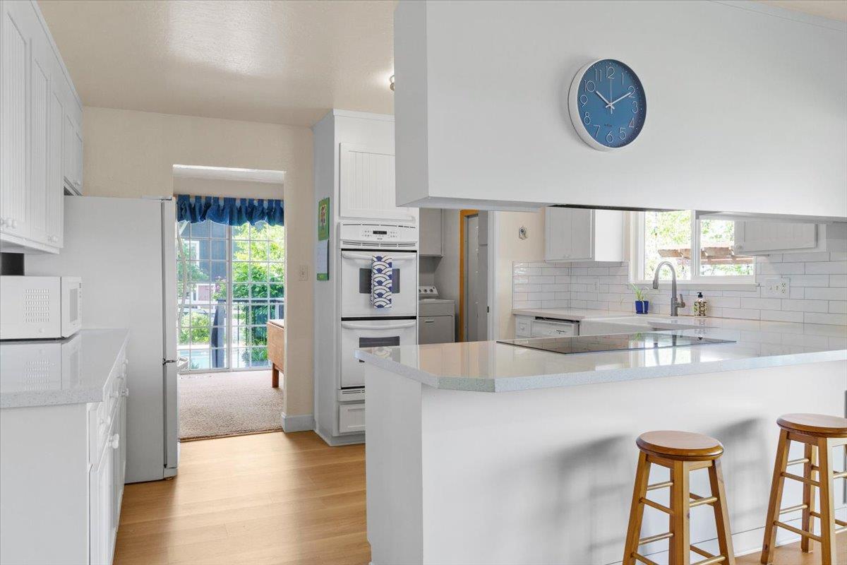 6980 Crystal Boulevard El Dorado, CA 95623 - Photo 38 of 49 a kitchen with stainless steel appliances kitchen island granite countertop a refrigerator and a stove top oven