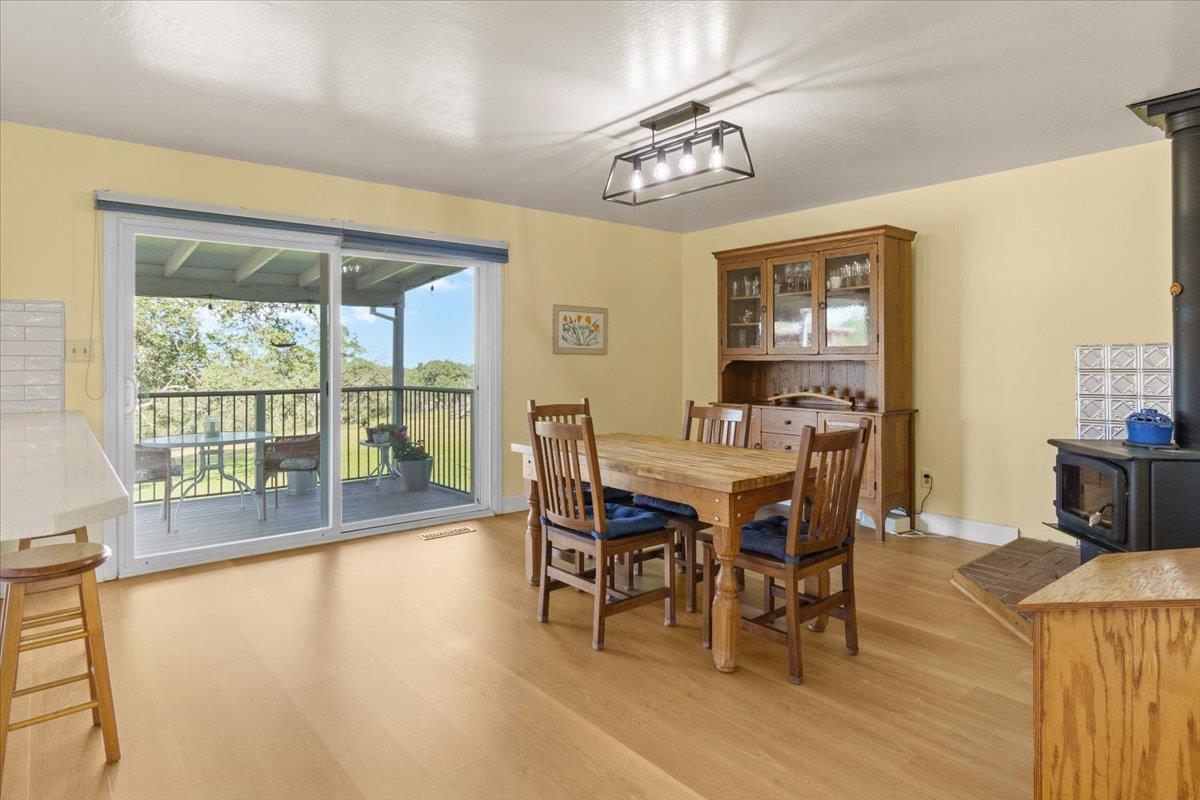 6980 Crystal Boulevard El Dorado, CA 95623 - Photo 41 of 49 a dining room with furniture a chandelier and wooden floor