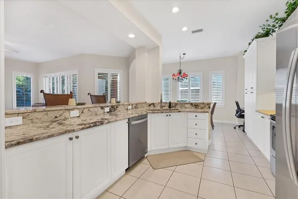 a bathroom with a granite countertop sink mirror and a