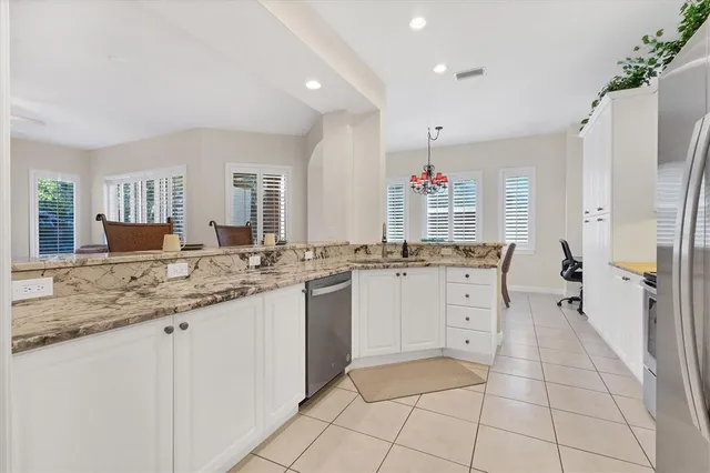 a bathroom with a granite countertop sink mirror and a