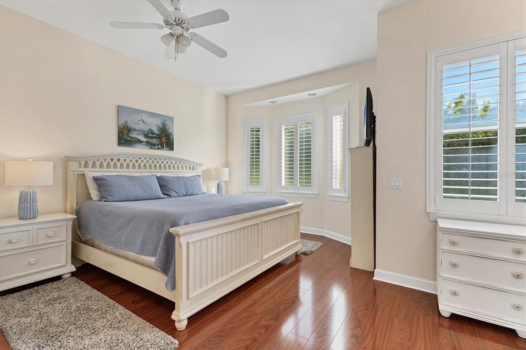 5425 46th Court West Bradenton, FL 34210 - Photo 14 of 39 a spacious bedroom with a bed and a window