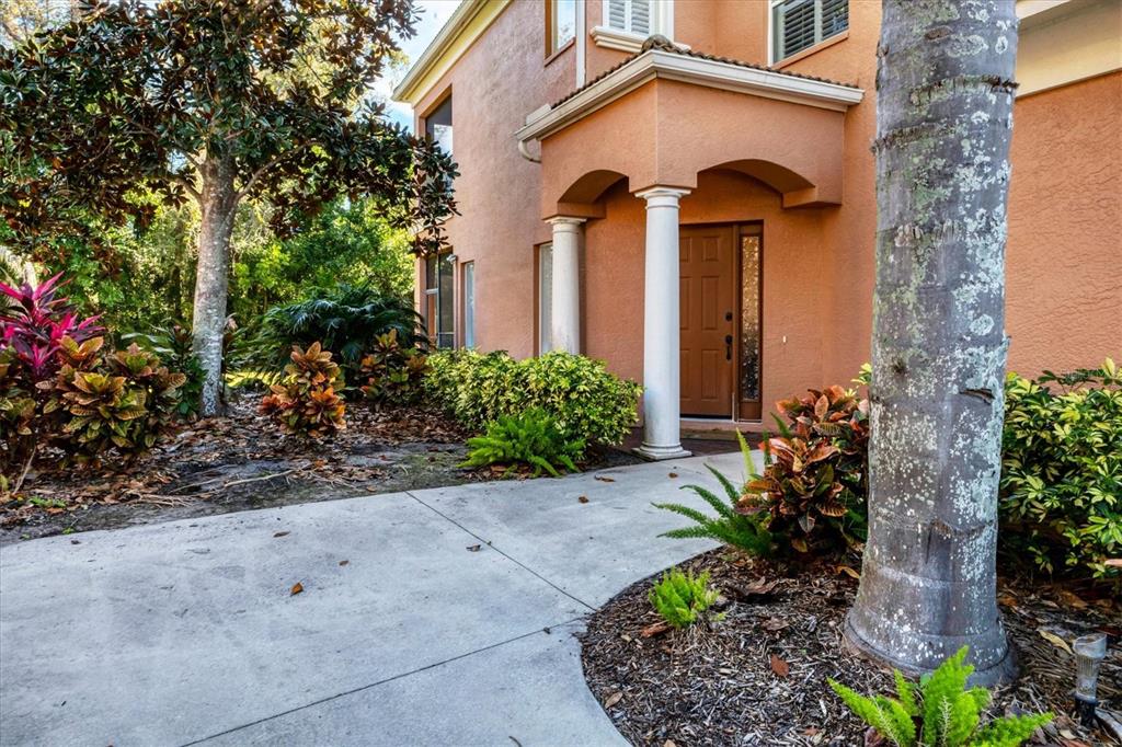 5425 46th Court West Bradenton, FL 34210 - Photo 2 of 39 a front view of a house with garden