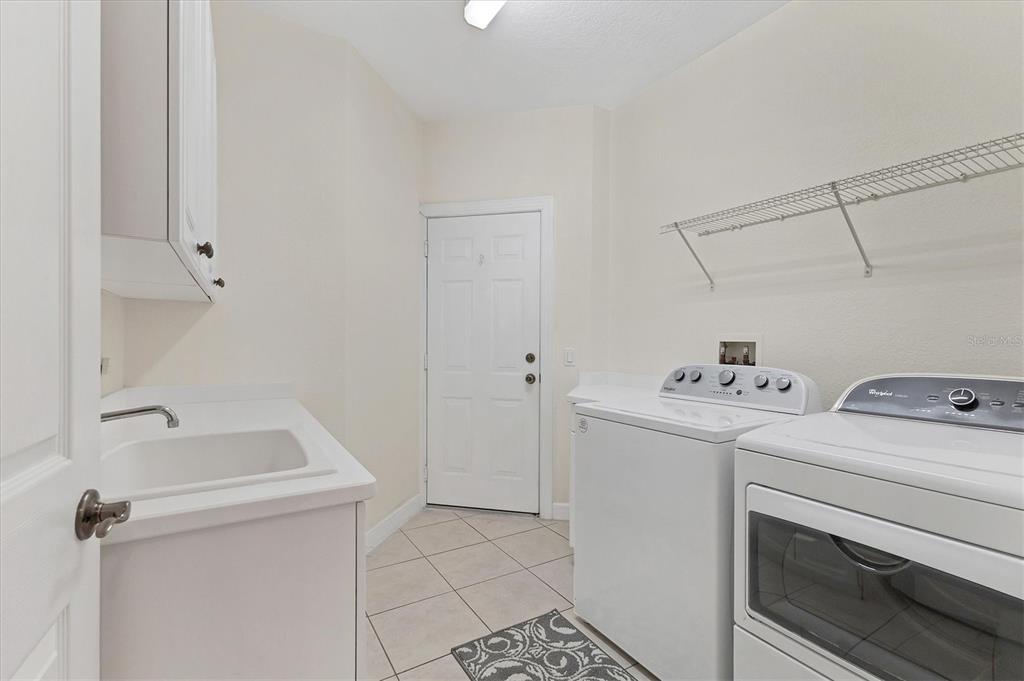 5425 46th Court West Bradenton, FL 34210 - Photo 22 of 39 a utility room with dryer and washer