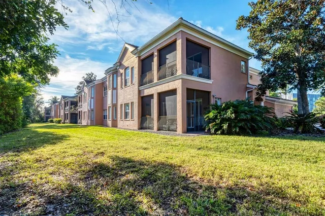 a view of a house with a yard