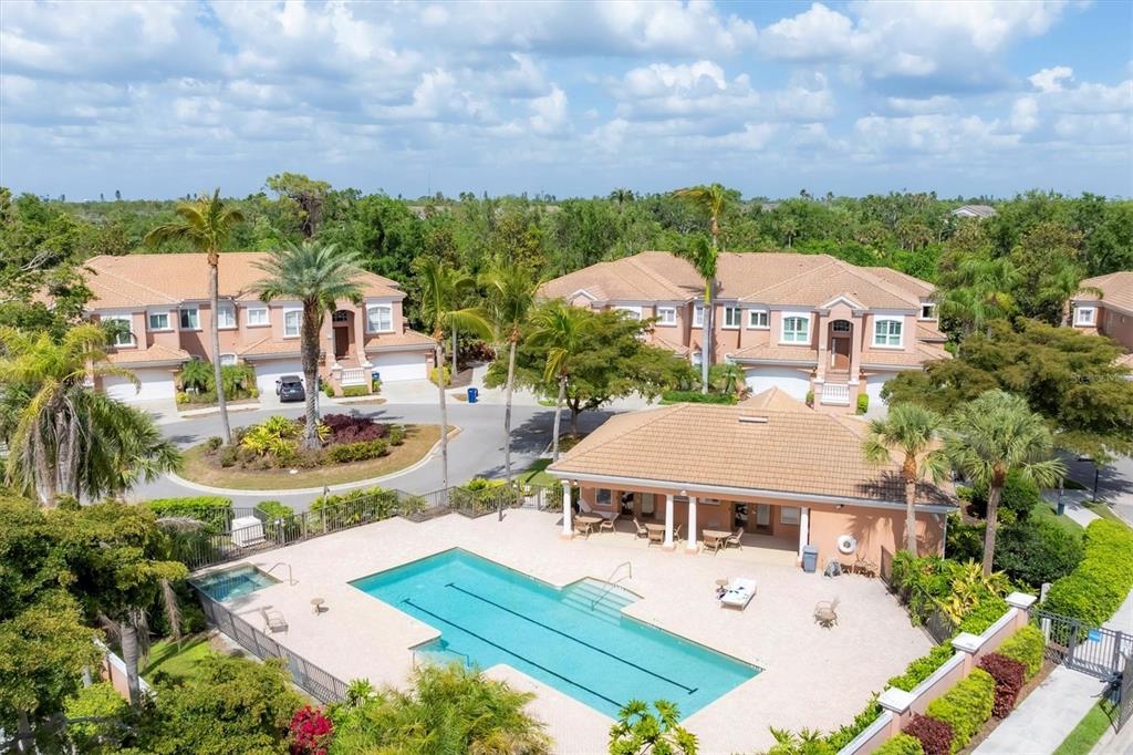 5425 46th Court West Bradenton, FL 34210 - Photo 27 of 39 an aerial view of multiple houses with a yard