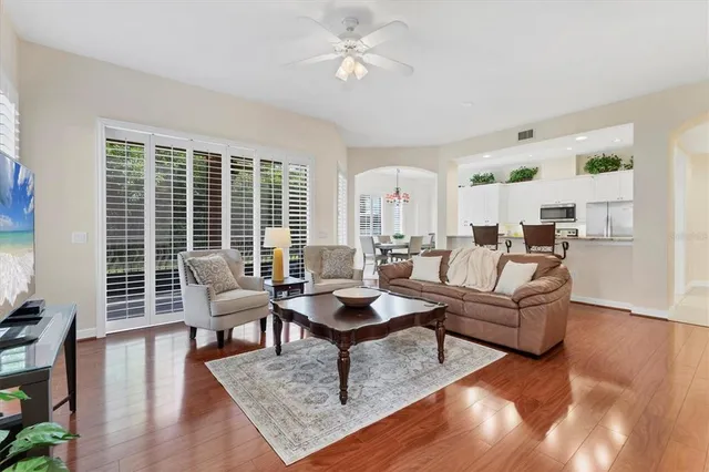 a living room with furniture and a large window