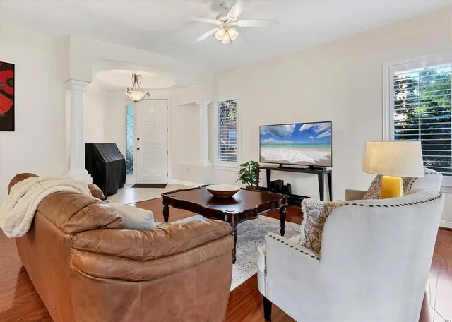 a living room with furniture and a flat screen tv