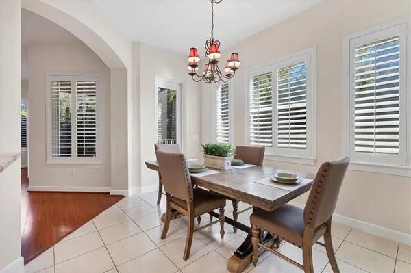 a view of a dining room with furniture and window