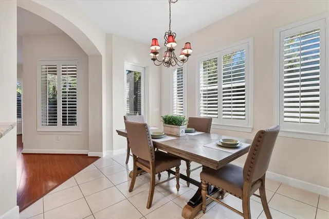a view of a dining room with furniture and window