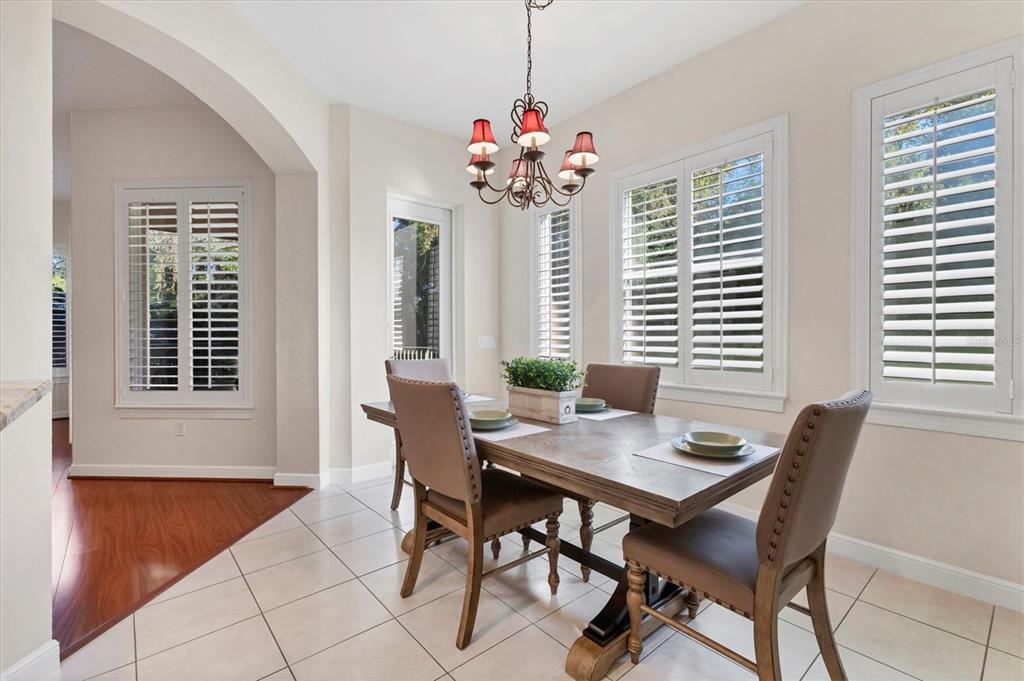 5425 46th Court West Bradenton, FL 34210 - Photo 7 of 39 a view of a dining room with furniture and window