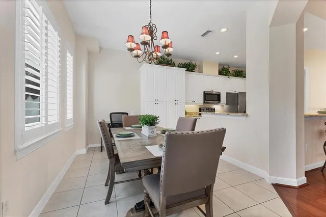 a dining room with furniture and window