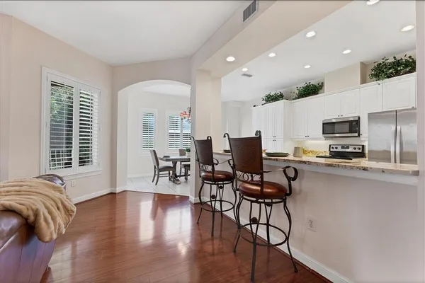 a view of kitchen with sink and wooden floor