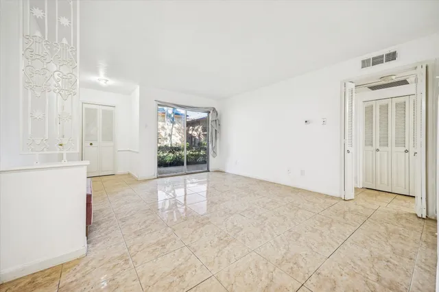 a spacious bathroom with a granite countertop sink and dishwasher