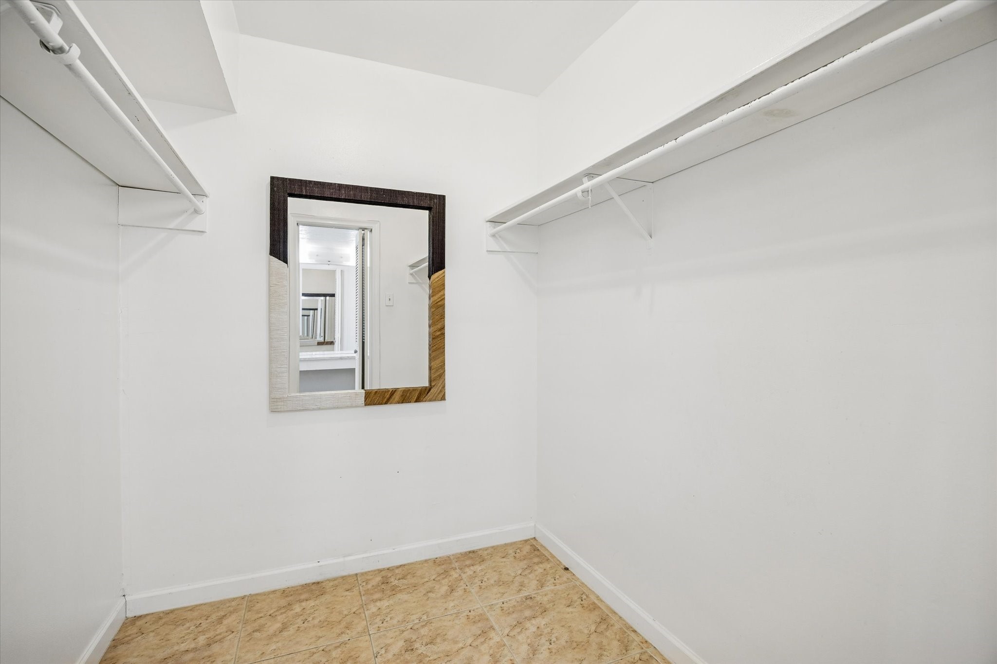 7600 Burgoyne Road, Unit 143 Houston, TX 77063 - Photo 8 of 17 a view of a small space with wooden floor and a window