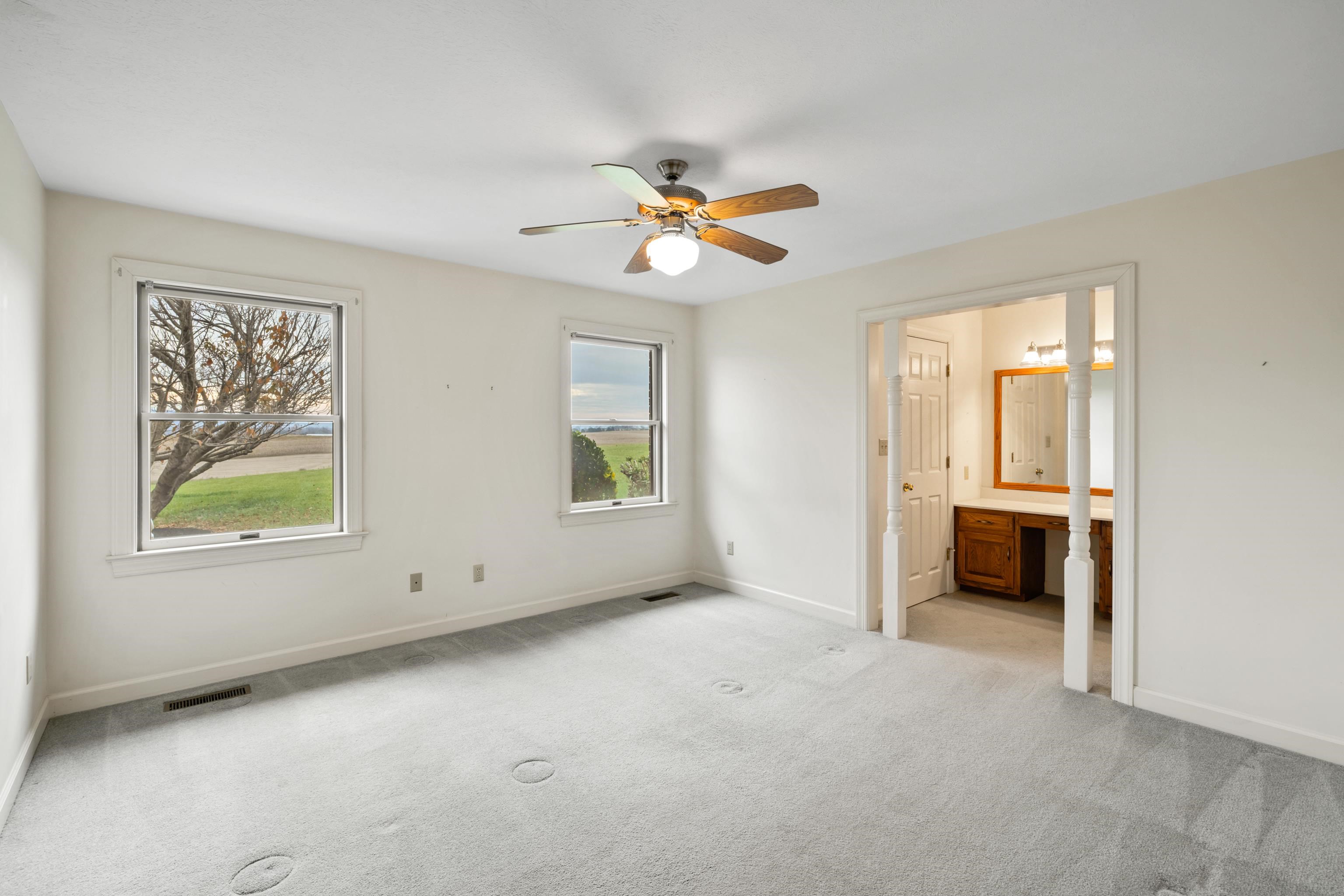 53 Strickley Road Grottoes, VA 24441 - Photo 27 of 58 an empty room with windows and chandelier fan