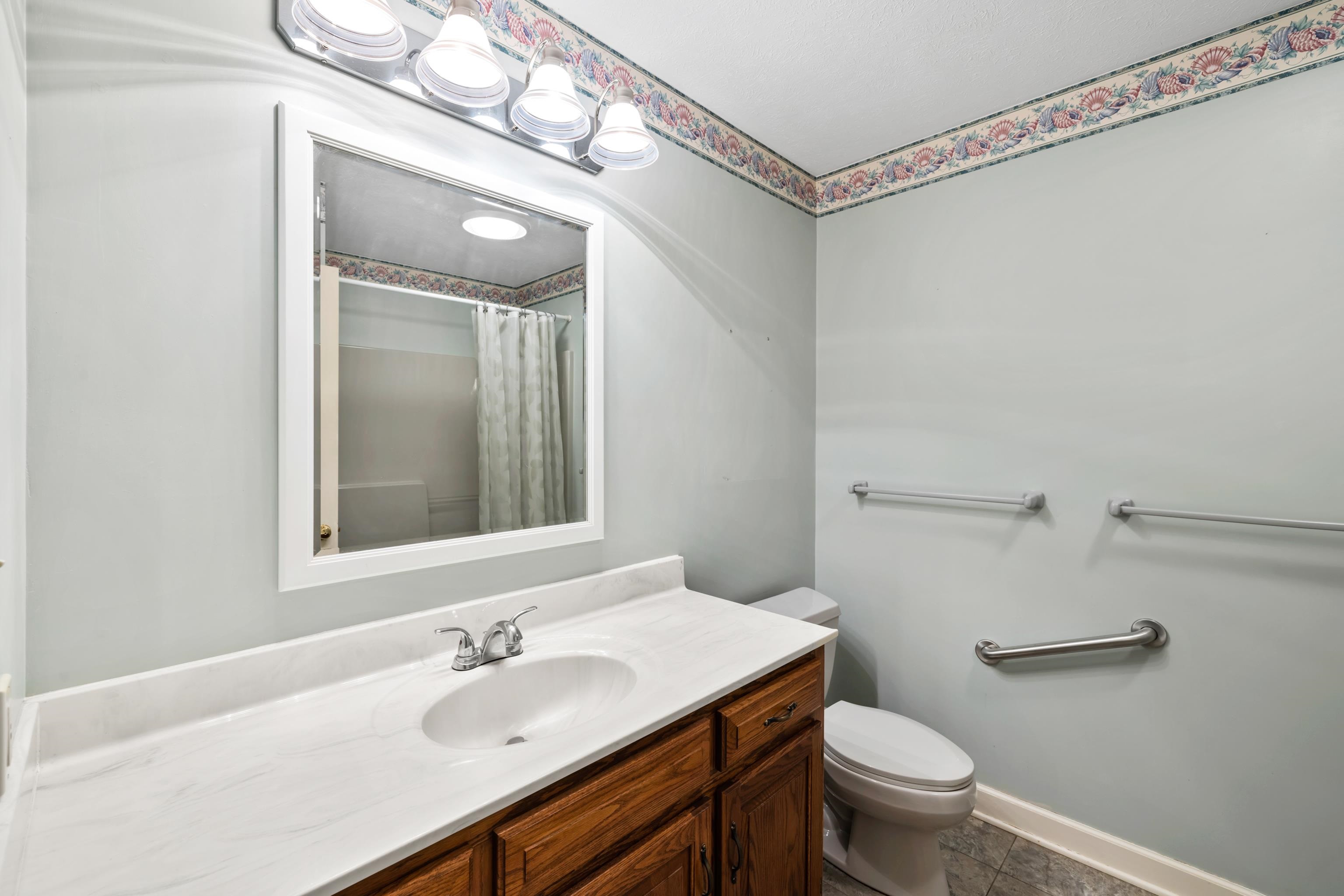 53 Strickley Road Grottoes, VA 24441 - Photo 29 of 58 a bathroom with a sink vanity mirror and toilet