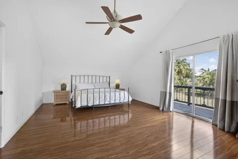 a view of a balcony with wooden floor