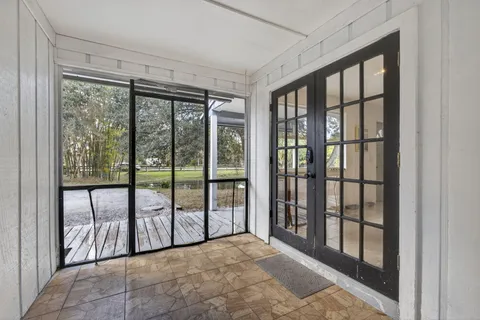 a house view with swimming pool in front of it