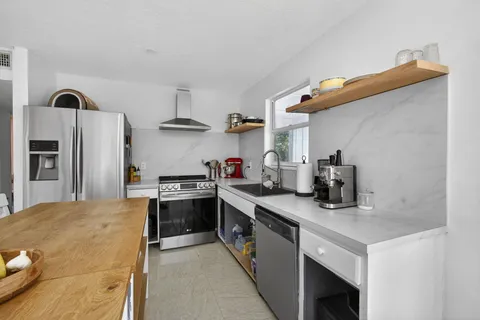 a room with furniture and a flat screen tv