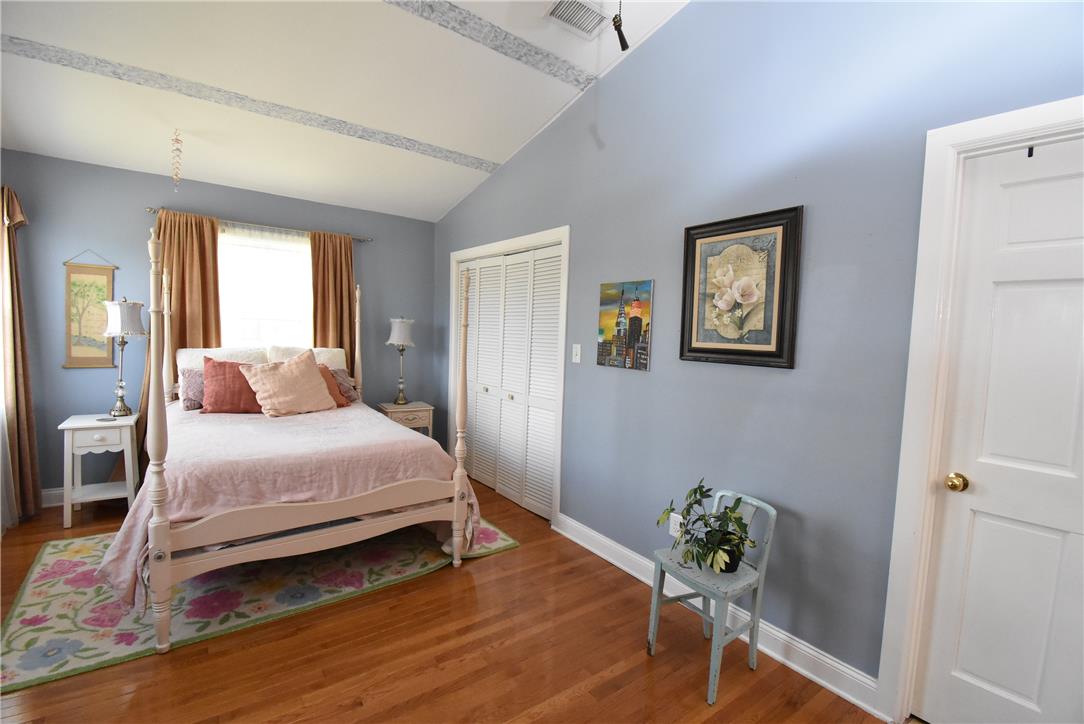424 Grape Street Whitehall, PA 18052 - Photo 31 of 50 This tranquil bedroom features vaulted ceilings and polished hardwood flooring, creating a comfortable retreat.