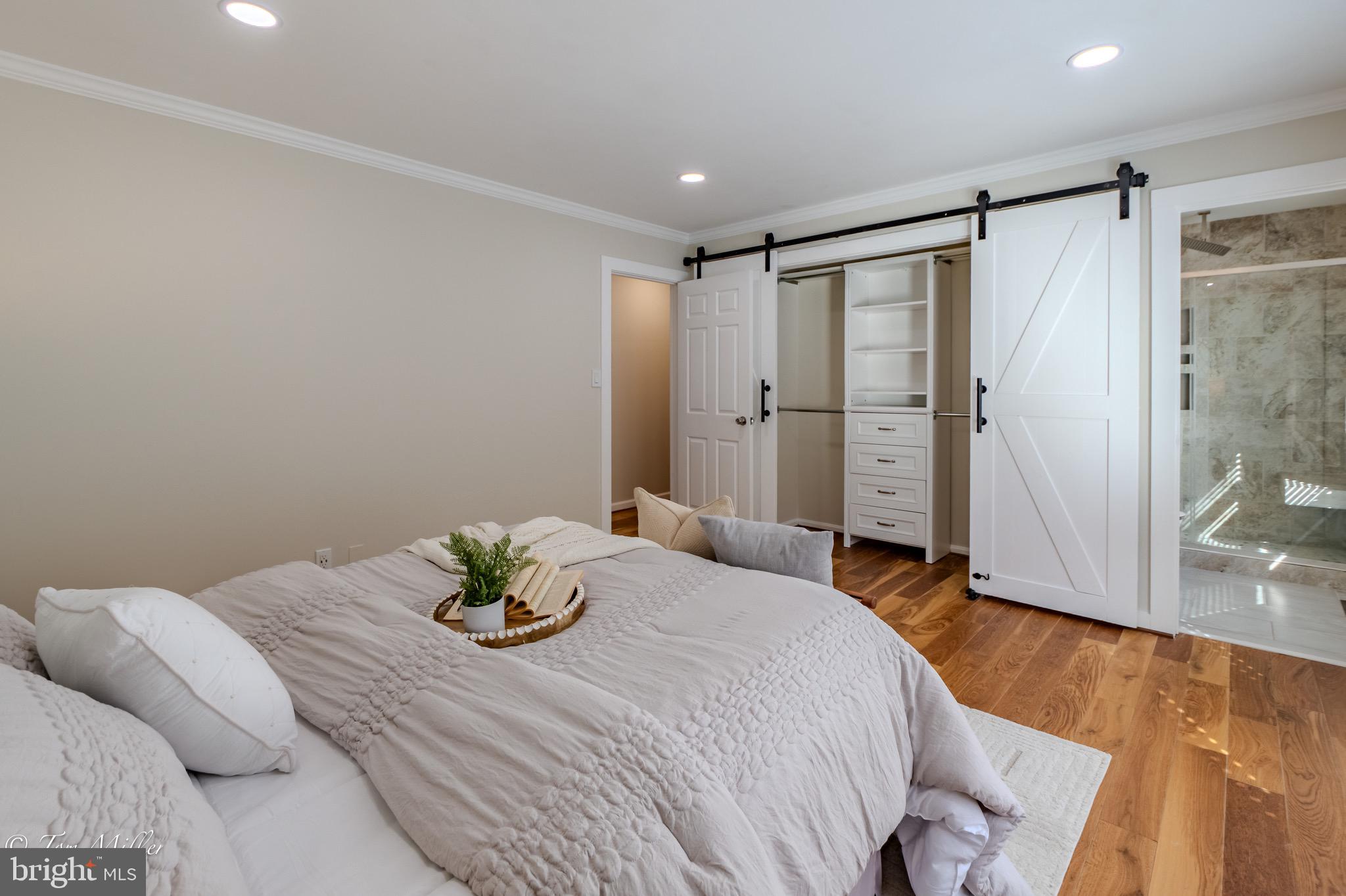 9544 Gunhill Circle Nottingham, MD 21236 - Photo 19 of 56 a bedroom with a bed and a potted plant