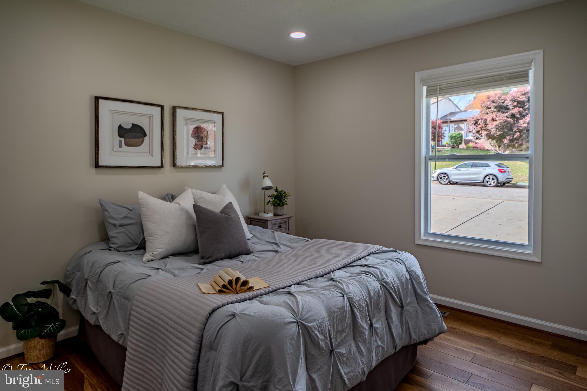 9544 Gunhill Circle Nottingham, MD 21236 - Photo 25 of 56 a bed sitting in a bedroom next to a window