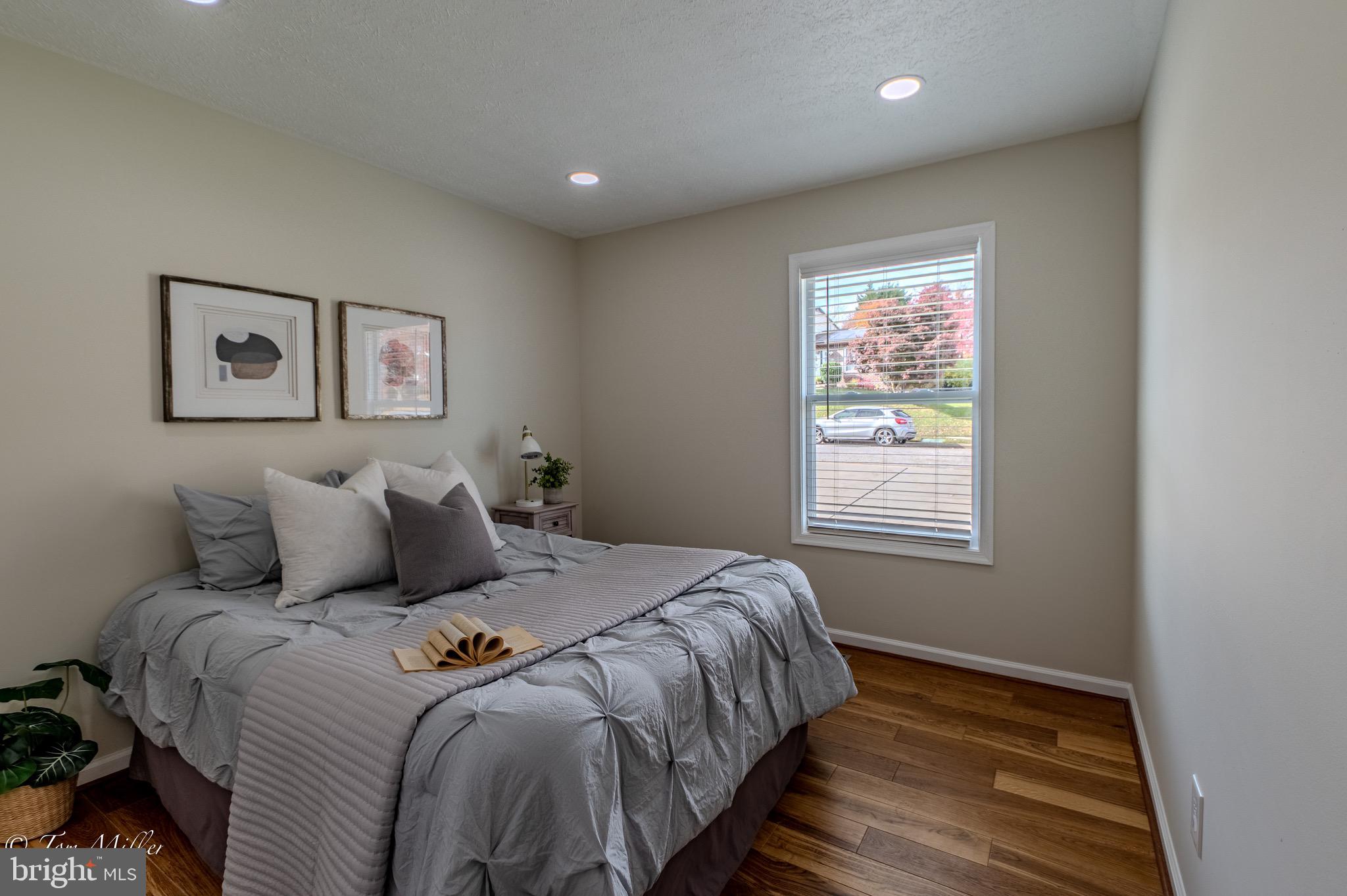 9544 Gunhill Circle Nottingham, MD 21236 - Photo 26 of 56 a bed sitting in a bedroom next to a window