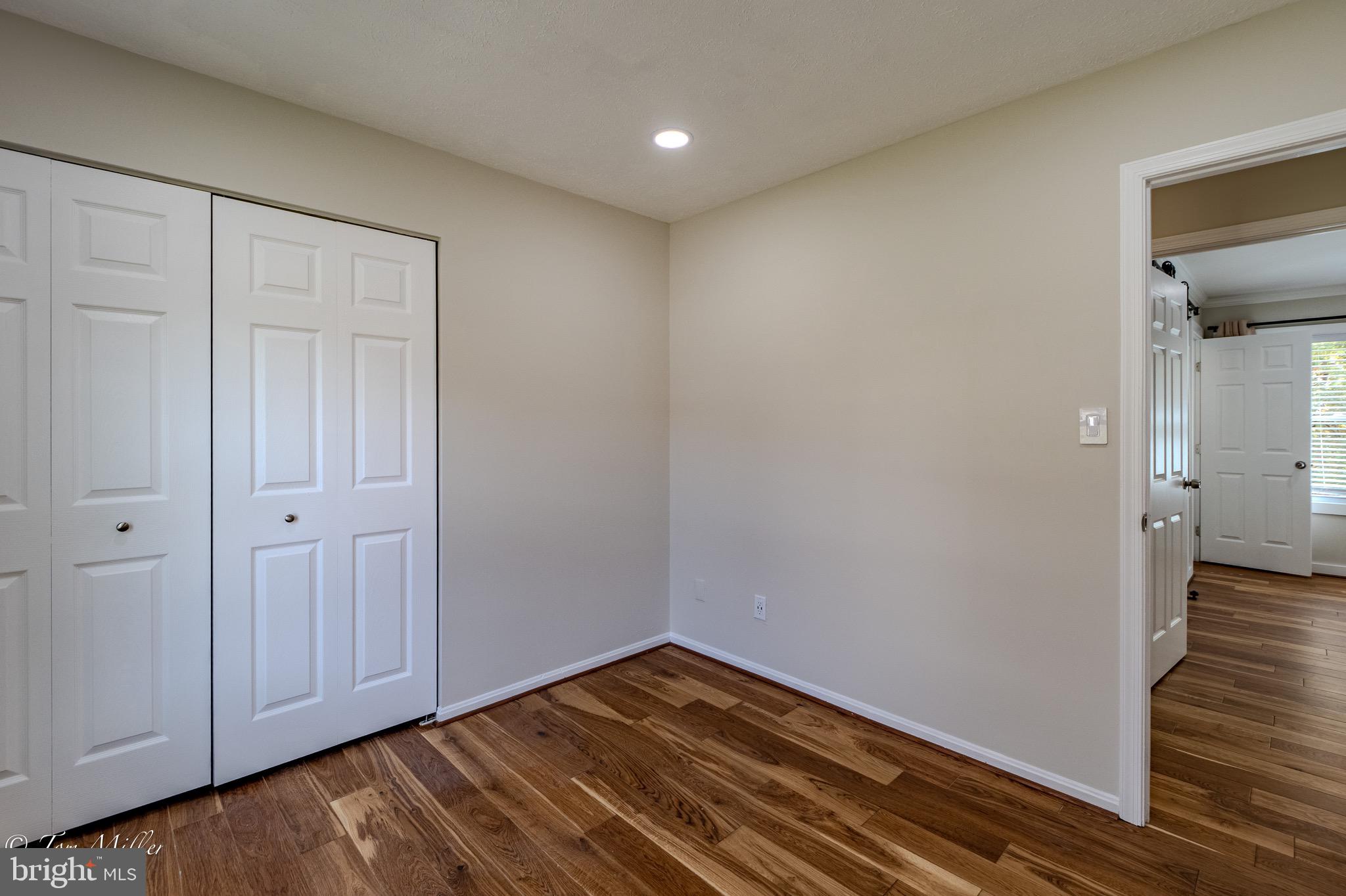 9544 Gunhill Circle Nottingham, MD 21236 - Photo 34 of 56 a view of empty room with wooden floor