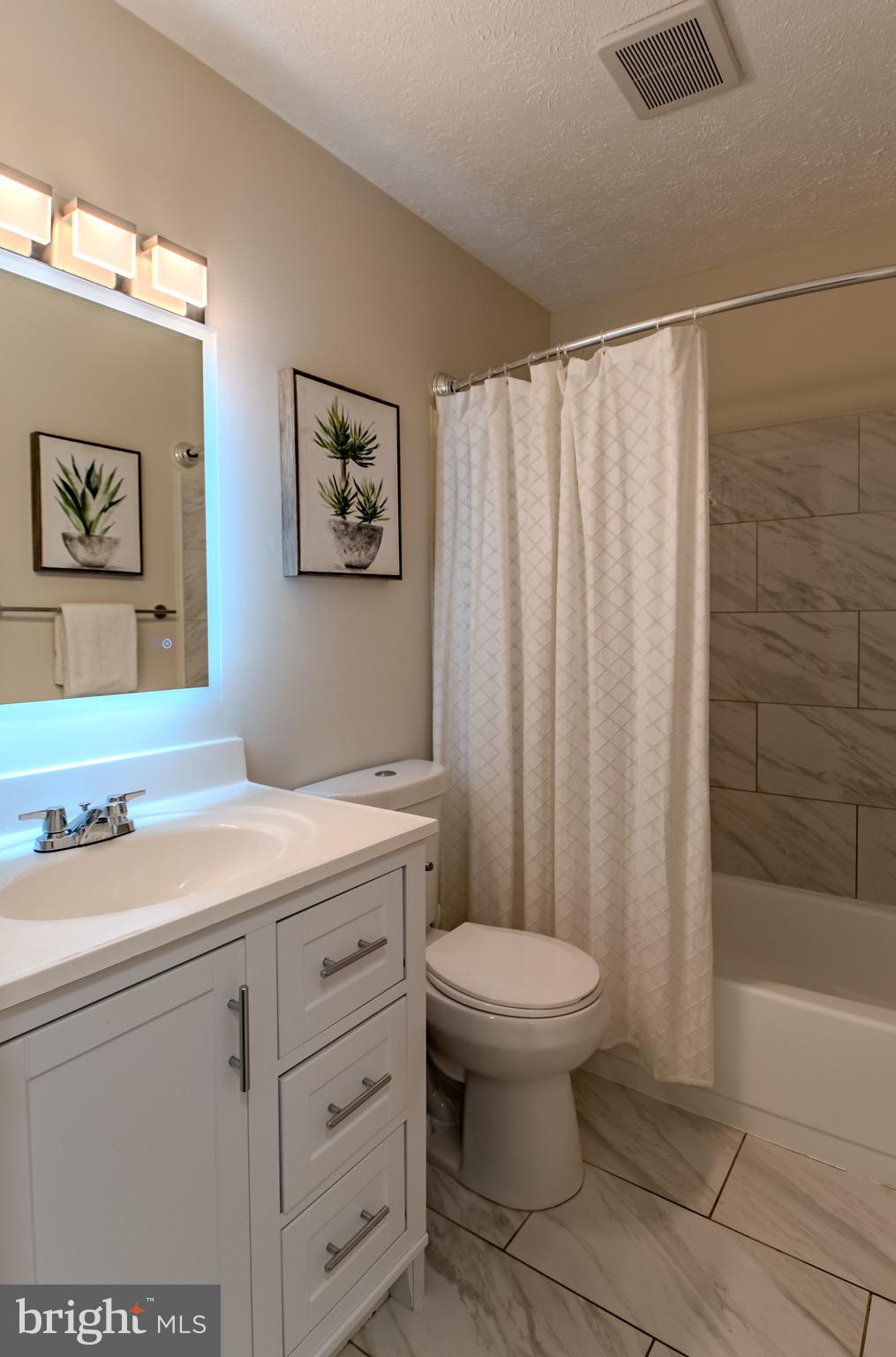 9544 Gunhill Circle Nottingham, MD 21236 - Photo 36 of 56 a bathroom with a sink a toilet and shower