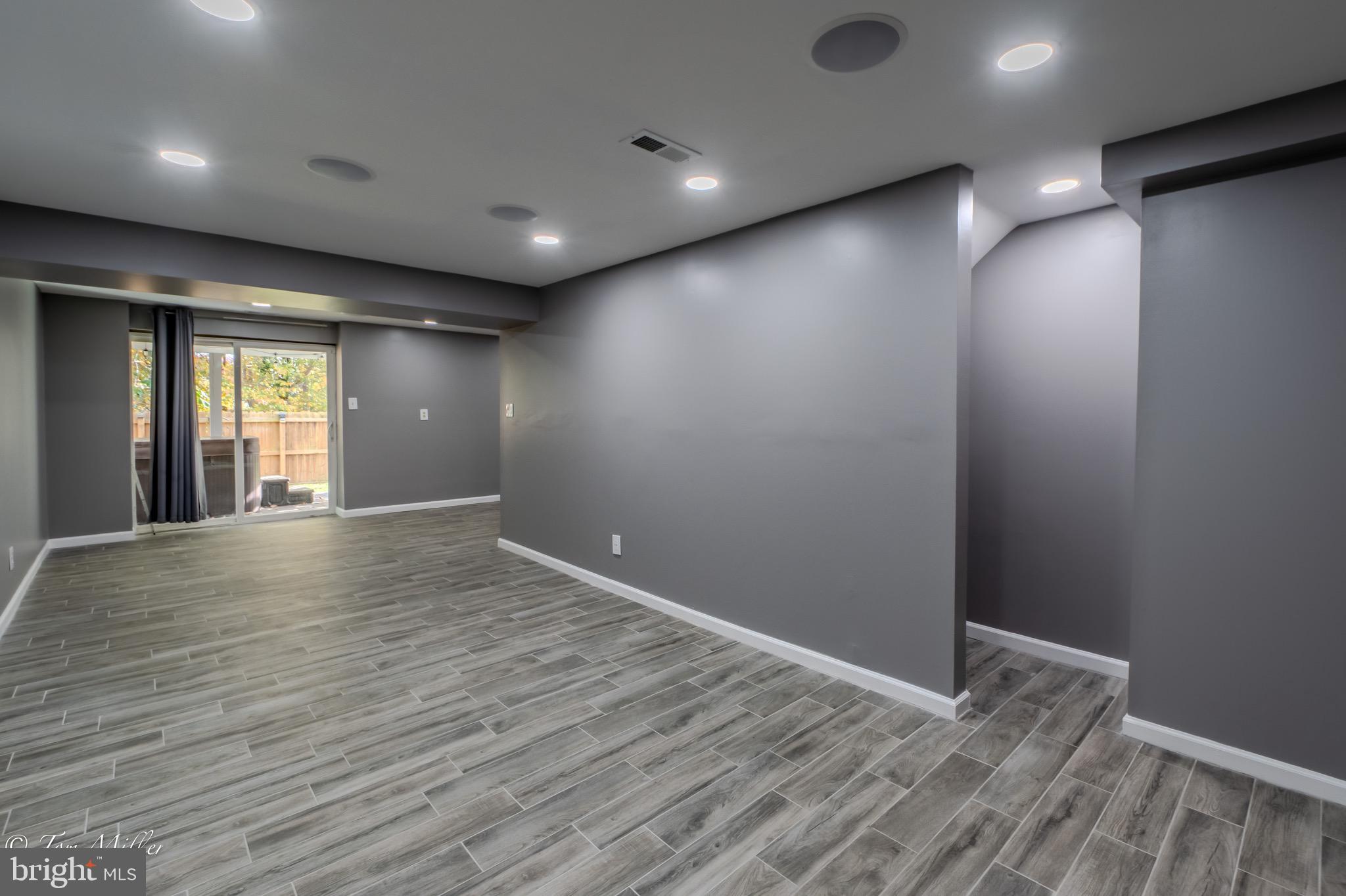 9544 Gunhill Circle Nottingham, MD 21236 - Photo 38 of 56 an empty room with wooden floor and windows