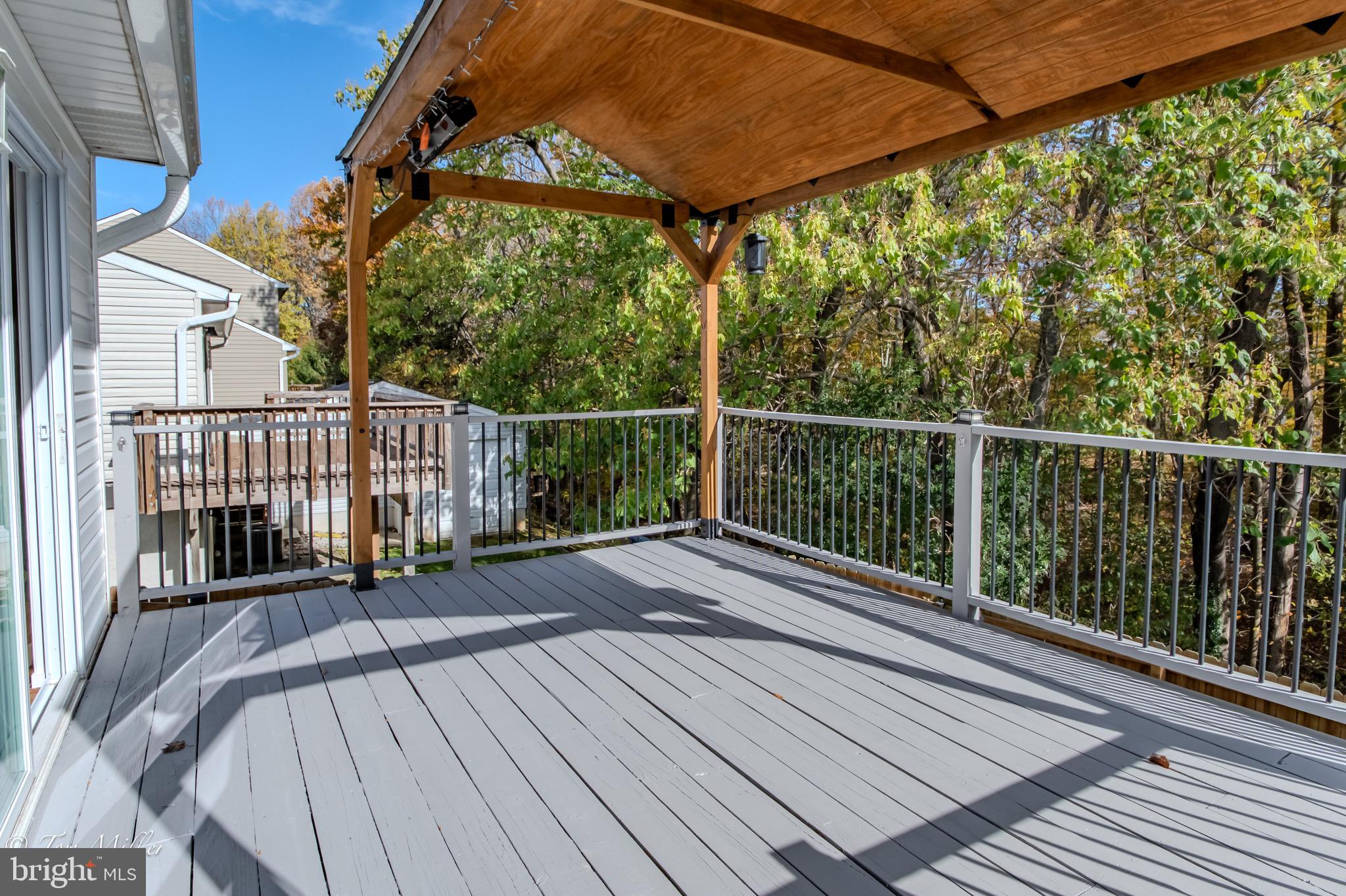 9544 Gunhill Circle Nottingham, MD 21236 - Photo 45 of 56 a view of balcony with wooden floor and fence