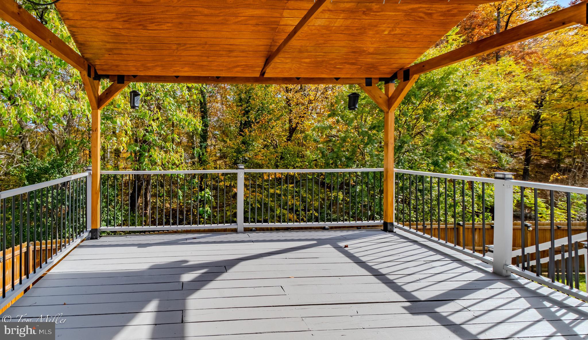 9544 Gunhill Circle Nottingham, MD 21236 - Photo 46 of 56 a view of balcony with wooden floor and fence