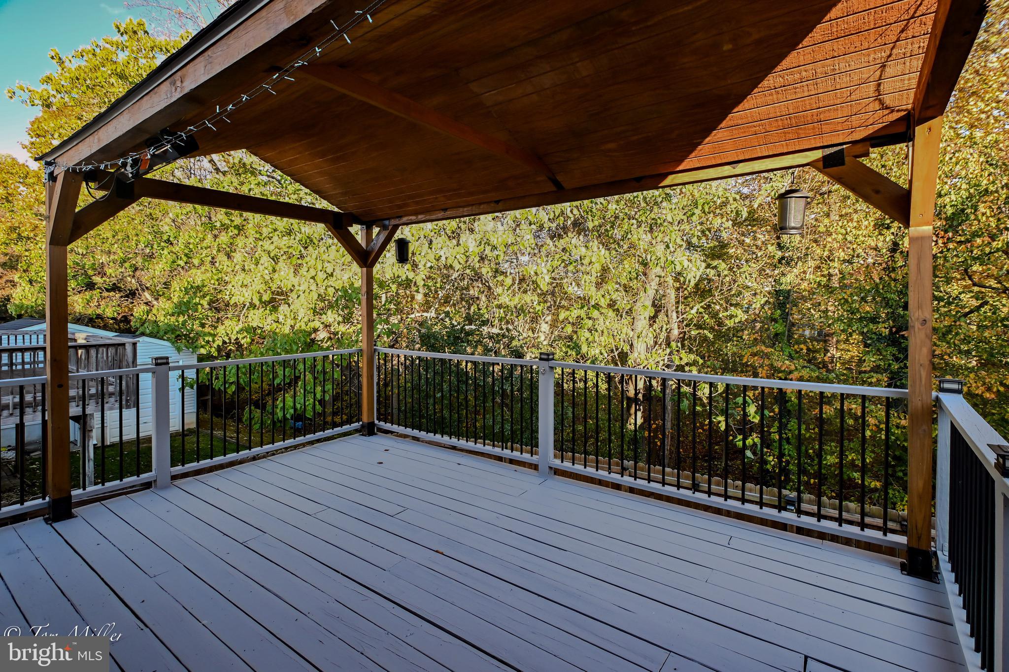 9544 Gunhill Circle Nottingham, MD 21236 - Photo 49 of 56 a view of a balcony with wooden floor