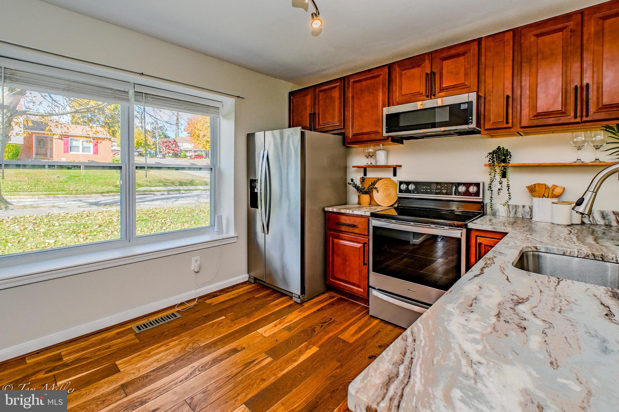 9544 Gunhill Circle Nottingham, MD 21236 - Photo 8 of 56 a kitchen with stainless steel appliances granite countertop a refrigerator and a sink