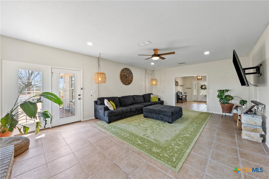 3000 West Amity Road Belton, TX 76513 - Photo 12 of 45 a living room with furniture and a rug