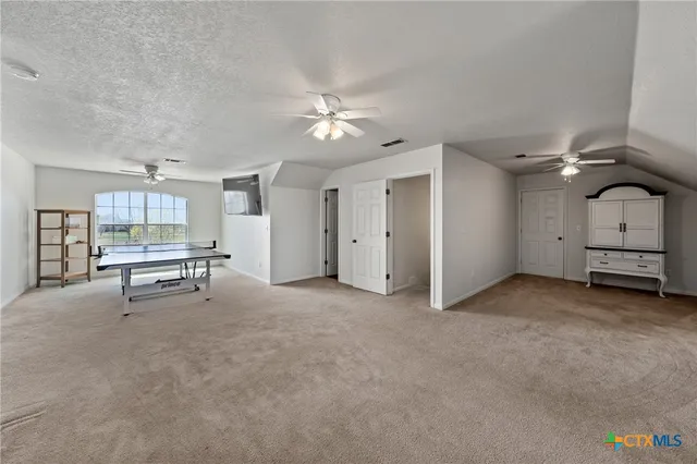 a view of a livingroom with furniture and a potted plant