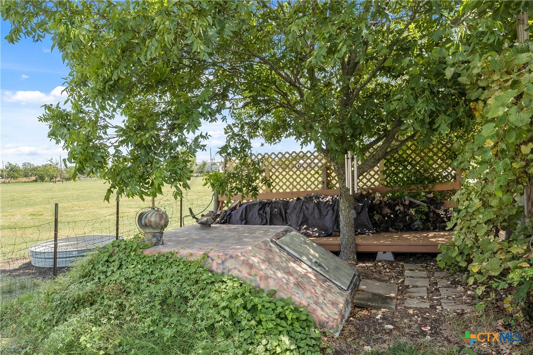 3000 West Amity Road Belton, TX 76513 - Photo 37 of 45 a view of a backyard with wooden fence and a bench