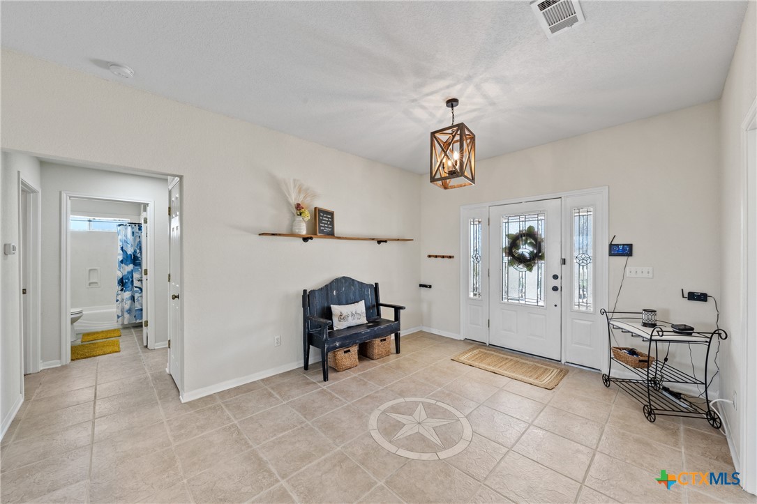 3000 West Amity Road Belton, TX 76513 - Photo 9 of 45 a view of a livingroom with workspace and a window