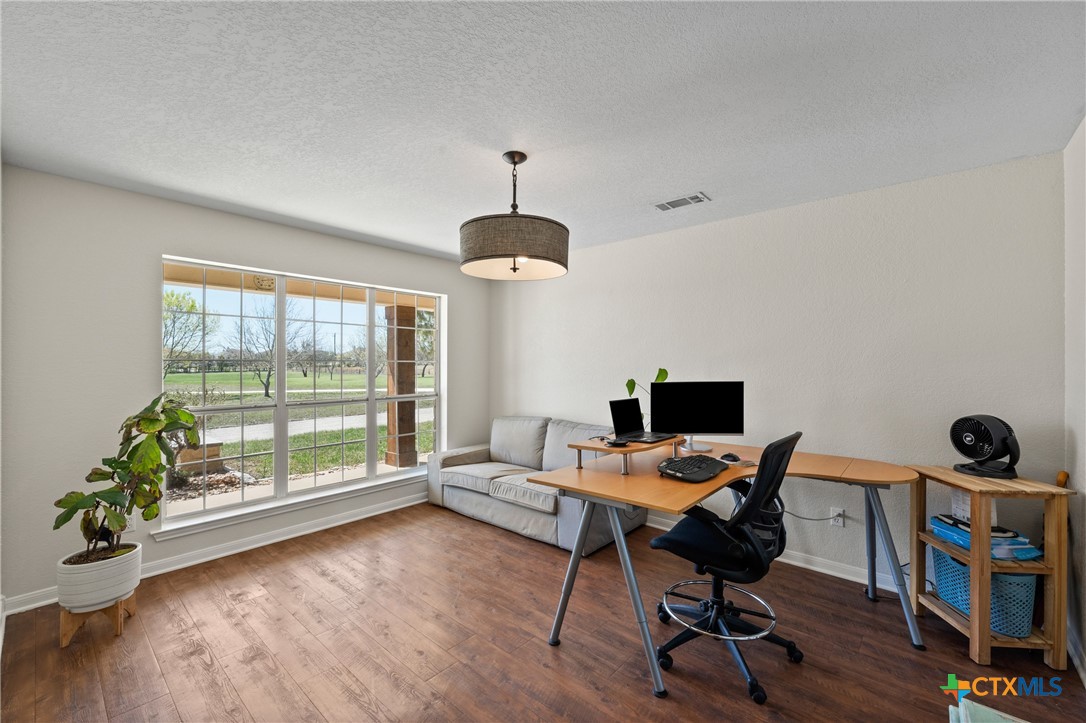 3000 West Amity Road Belton, TX 76513 - Photo 10 of 45 a view of a workspace with furniture and a window