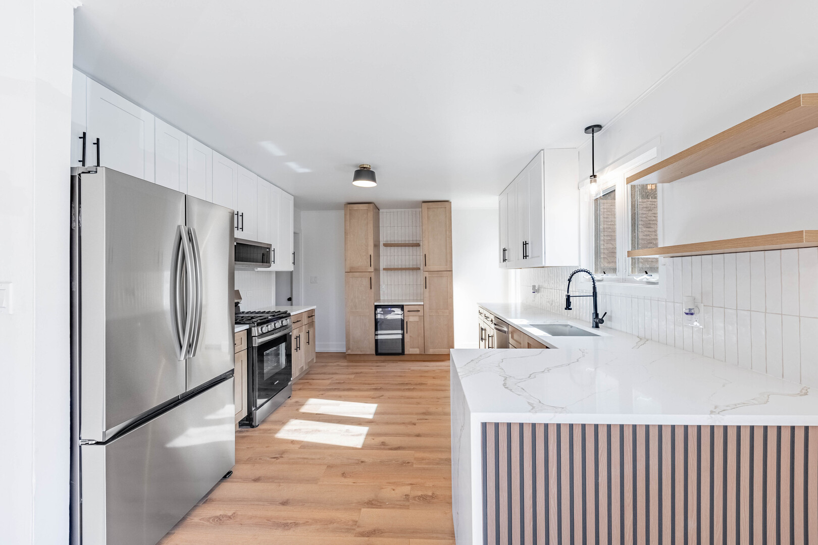 2N281 Bloomingdale Road Glendale Heights, IL 60139 - Photo 8 of 22 a kitchen with stainless steel appliances kitchen island granite countertop a refrigerator and a sink