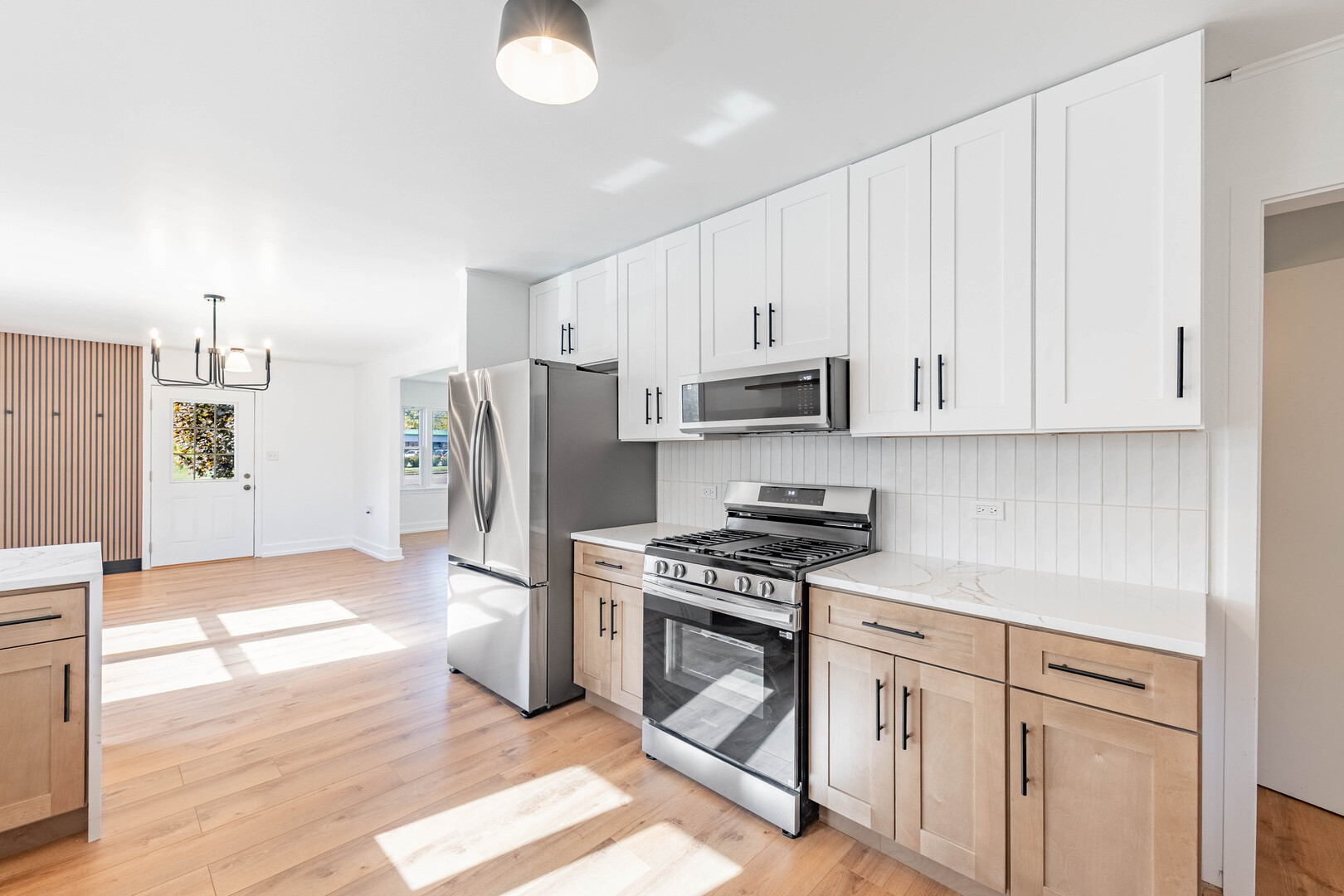 2N281 Bloomingdale Road Glendale Heights, IL 60139 - Photo 9 of 22 a kitchen with stainless steel appliances white cabinets and a refrigerator