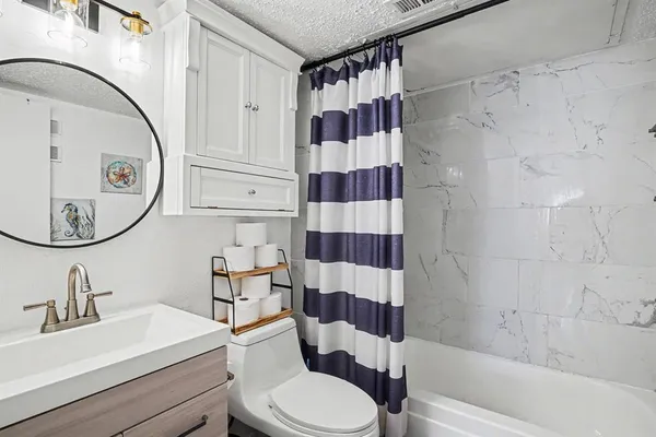 a view of a house with a door and wooden door