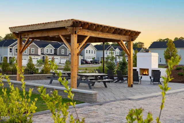 a front view of a house with outdoor seating