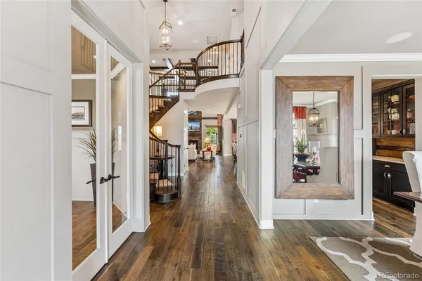 a view of a hallway view with wooden floor and staircase