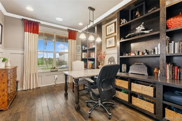 a dining room with furniture and a kitchen view