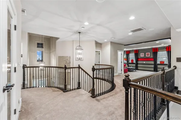 a view of a hallway with a flat screen tv