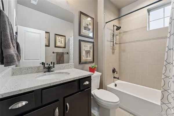 a bathroom with a sink a toilet and a bathtub