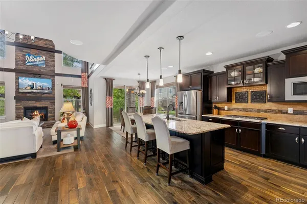 a large kitchen with a table and chairs