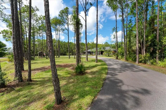 a kitchen with stainless steel appliances a refrigerator sink and microwave